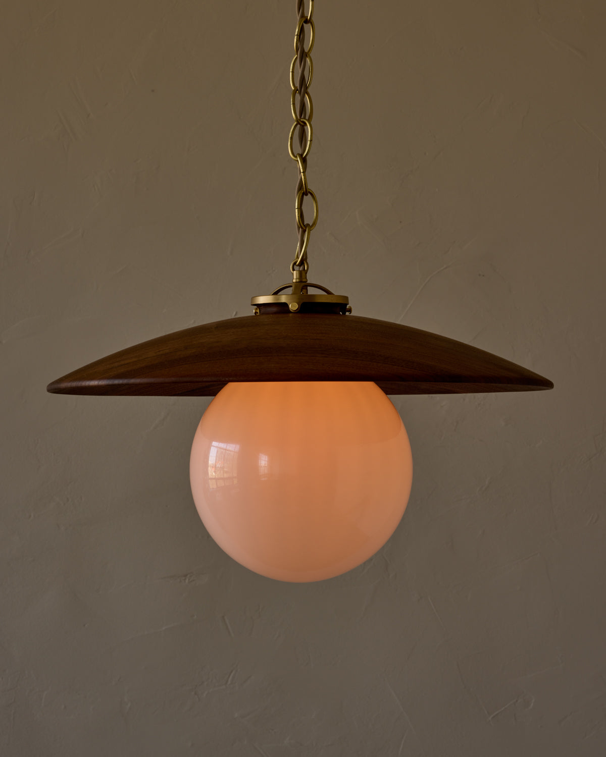 Large pendant light with oversized clear glass globe and decorative wooden clear maple shade with brass chain #shade-finish_black walnut #globe_white glass #cord-color_beige
