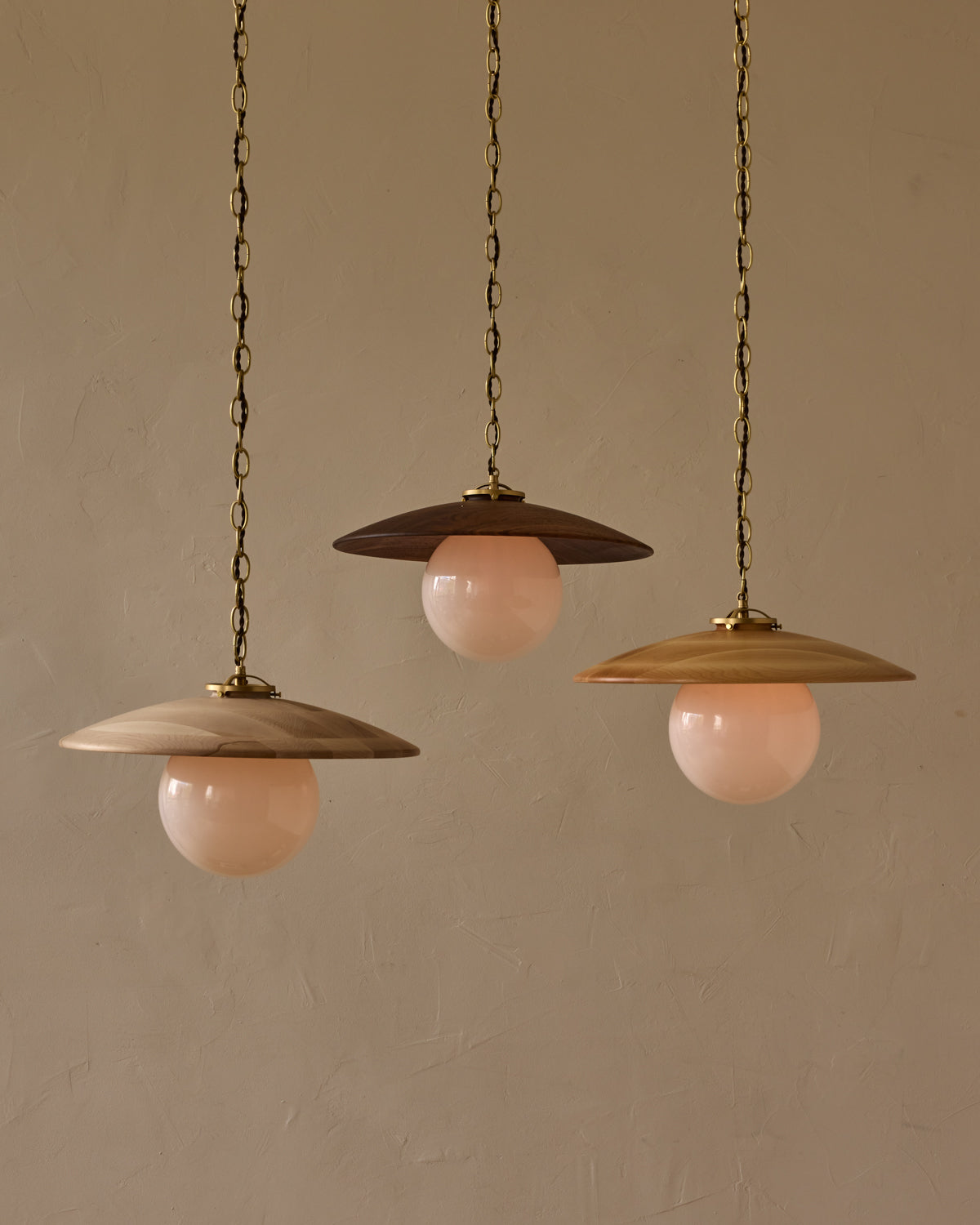 Large pendant light with oversized clear glass globe and decorative wooden clear maple shade with brass chain #shade-finish_natural maple #globe_white glass #cord-color_brown