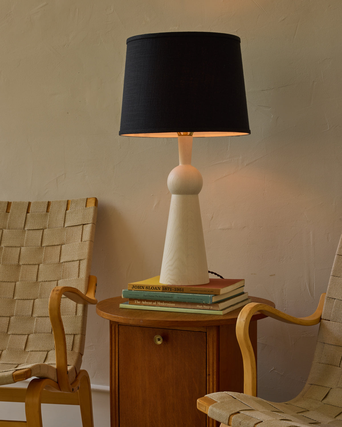 White wash solid wood table lamp with gently tapered body and black linen shade #wood-finish_white wash red oak #shade-color_black linen
