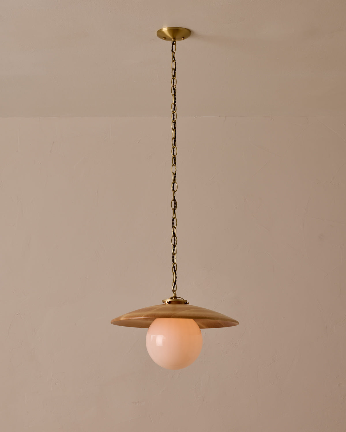 Large pendant light with oversized clear glass globe and decorative wooden clear maple shade with brass chain #shade-finish_natural maple #globe_white glass #cord-color_brown
