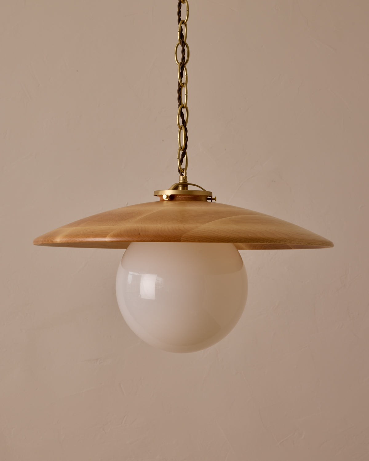Large pendant light with oversized clear glass globe and decorative wooden clear maple shade with brass chain #shade-finish_natural maple #globe_white glass #cord-color_brown