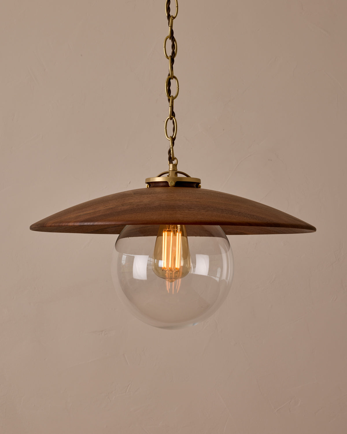 Large pendant light with oversized clear glass globe and decorative wooden clear maple shade with brass chain #shade-finish_black walnut #globe_clear glass #cord-color_brown