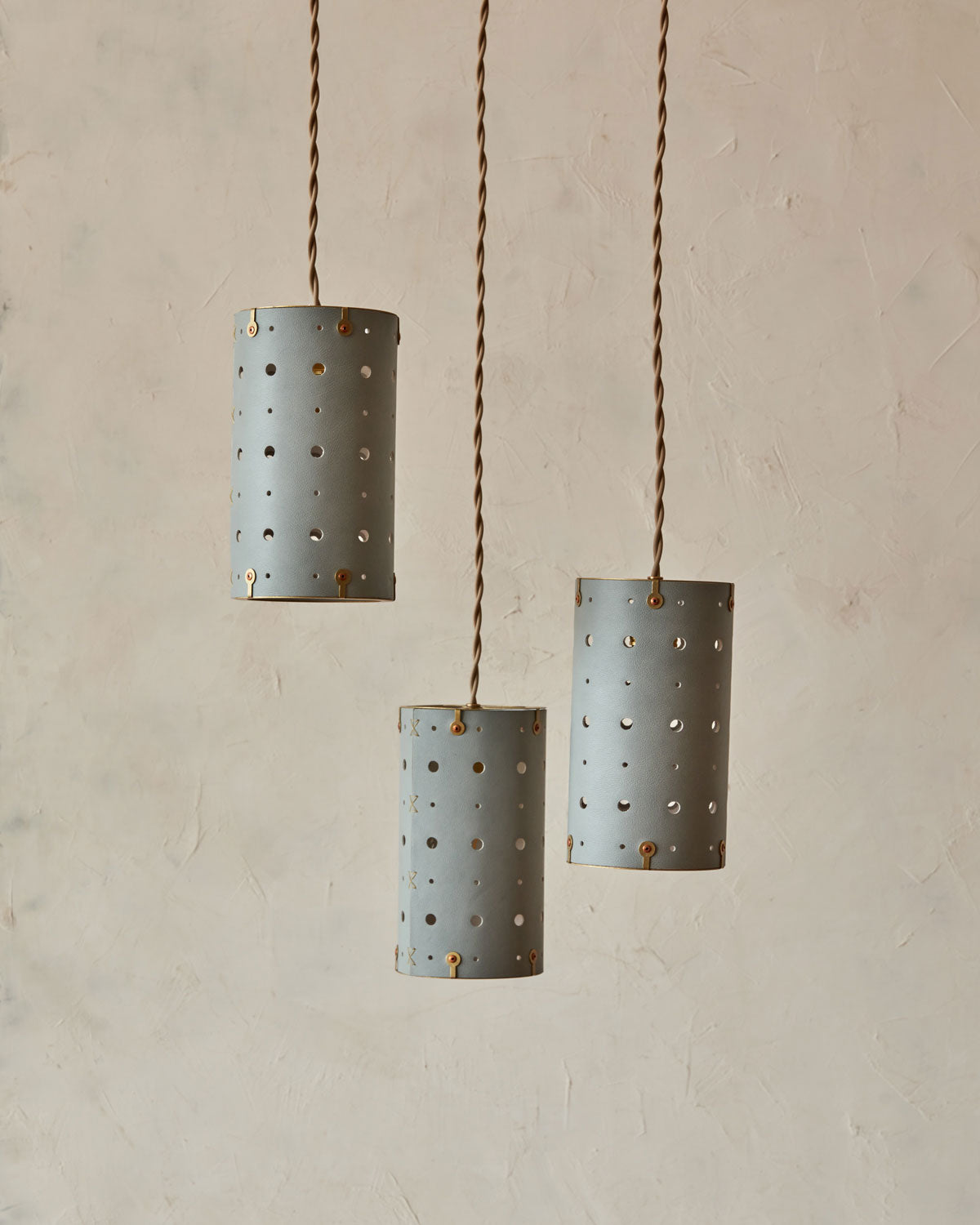 Charming leather pendant light with blue handstitched shade and brass accents #color_cloud blue