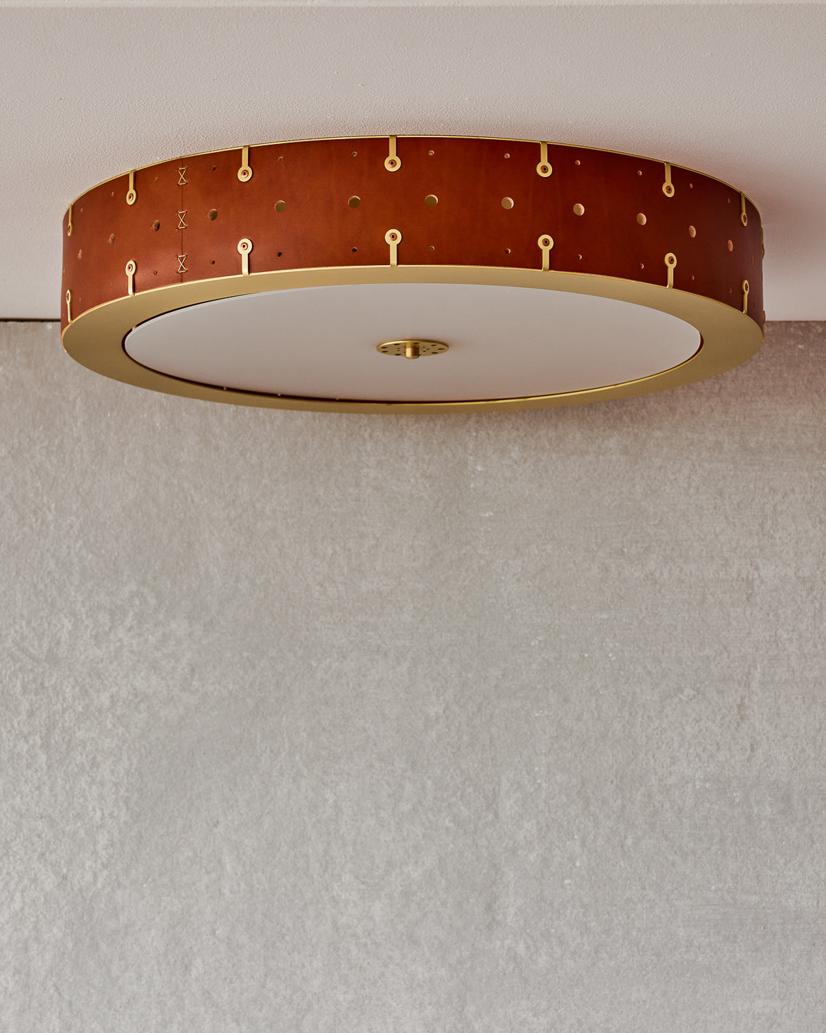 Beautiful satin brass flush mount ceiling fixture with handstitched leather drum shade #leather-color_tan harness