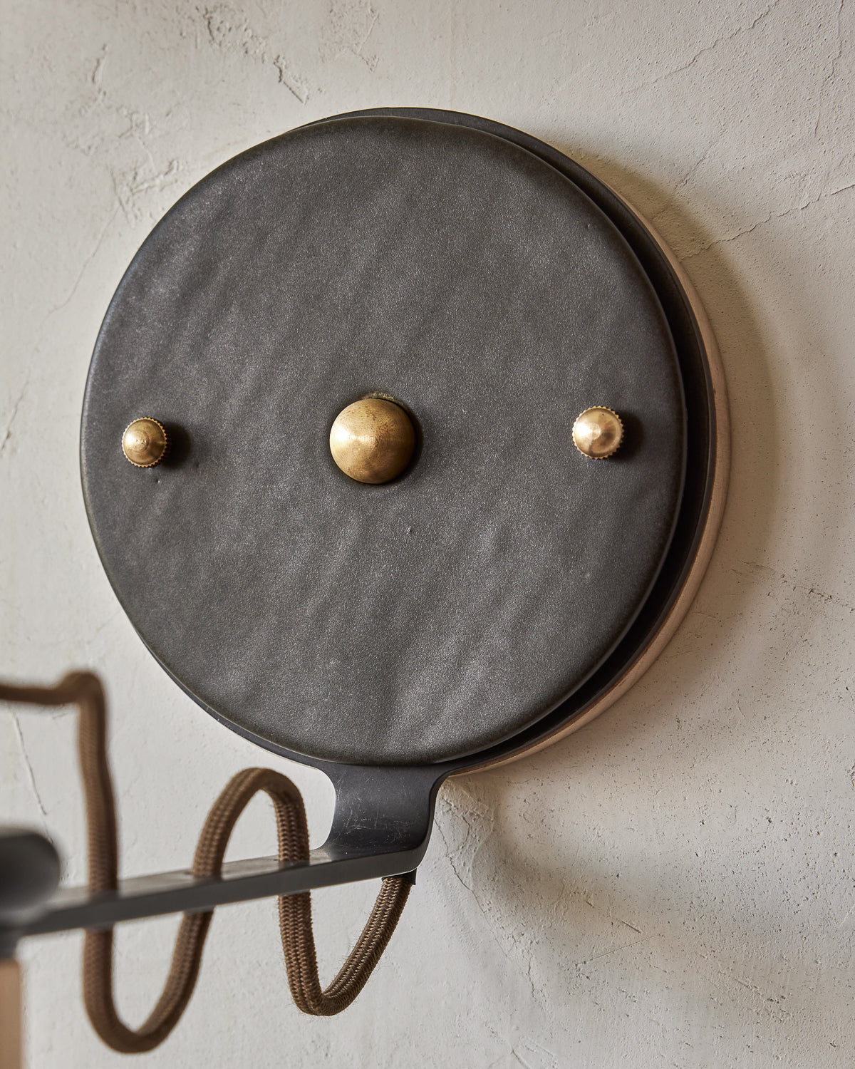 Maple, steel and ceramic wall sconce with articulating arm with matte black stoneware shade and backplate #color_almost black
