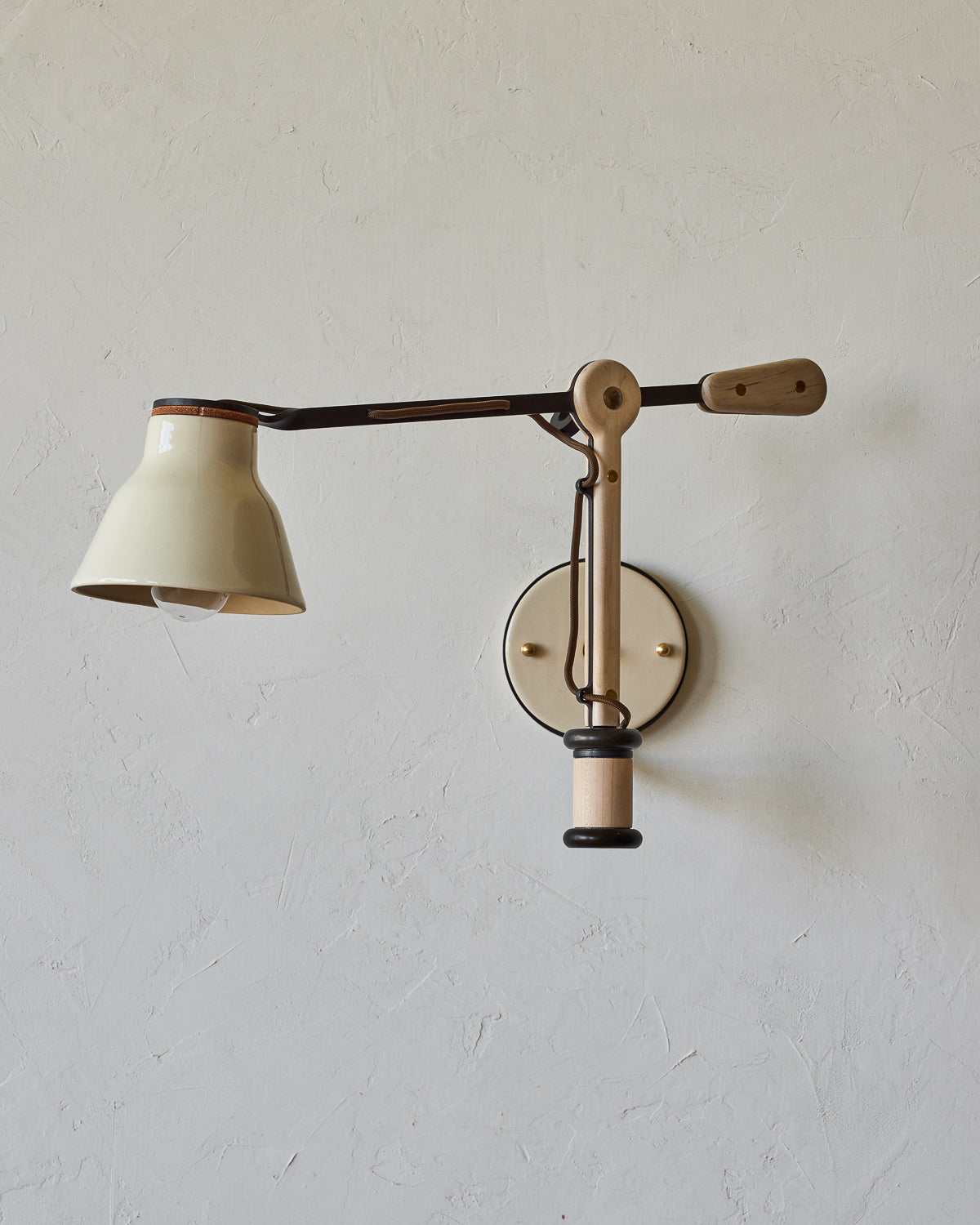 Maple, steel and ceramic wall sconce with articulating arm with glossy white stoneware shade #color_cream