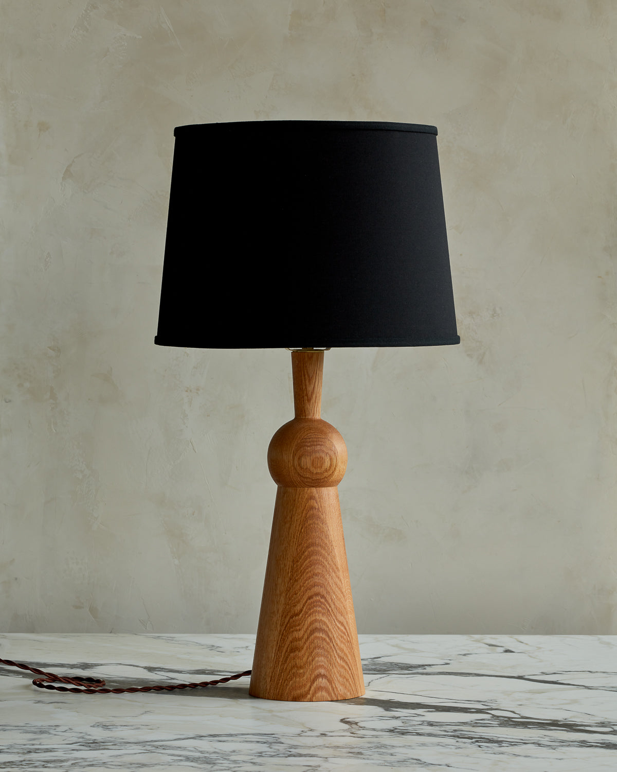 Natural red oak solid wood table lamp with gently tapered body and black linen shade #wood-finish_natural red oak #shade-color_black linen