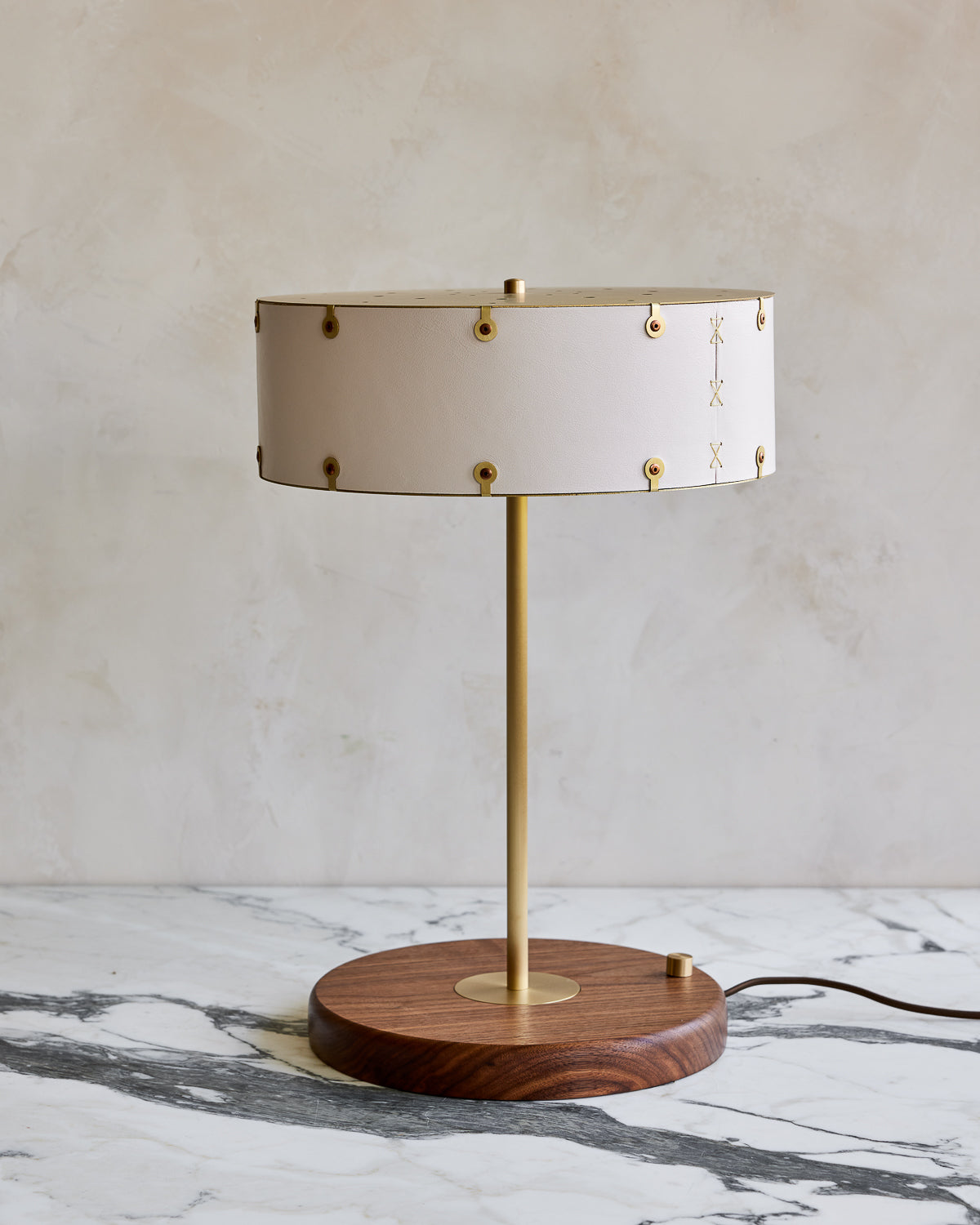 Brass table lamp with walnut base and white leather shade #color_dogwood