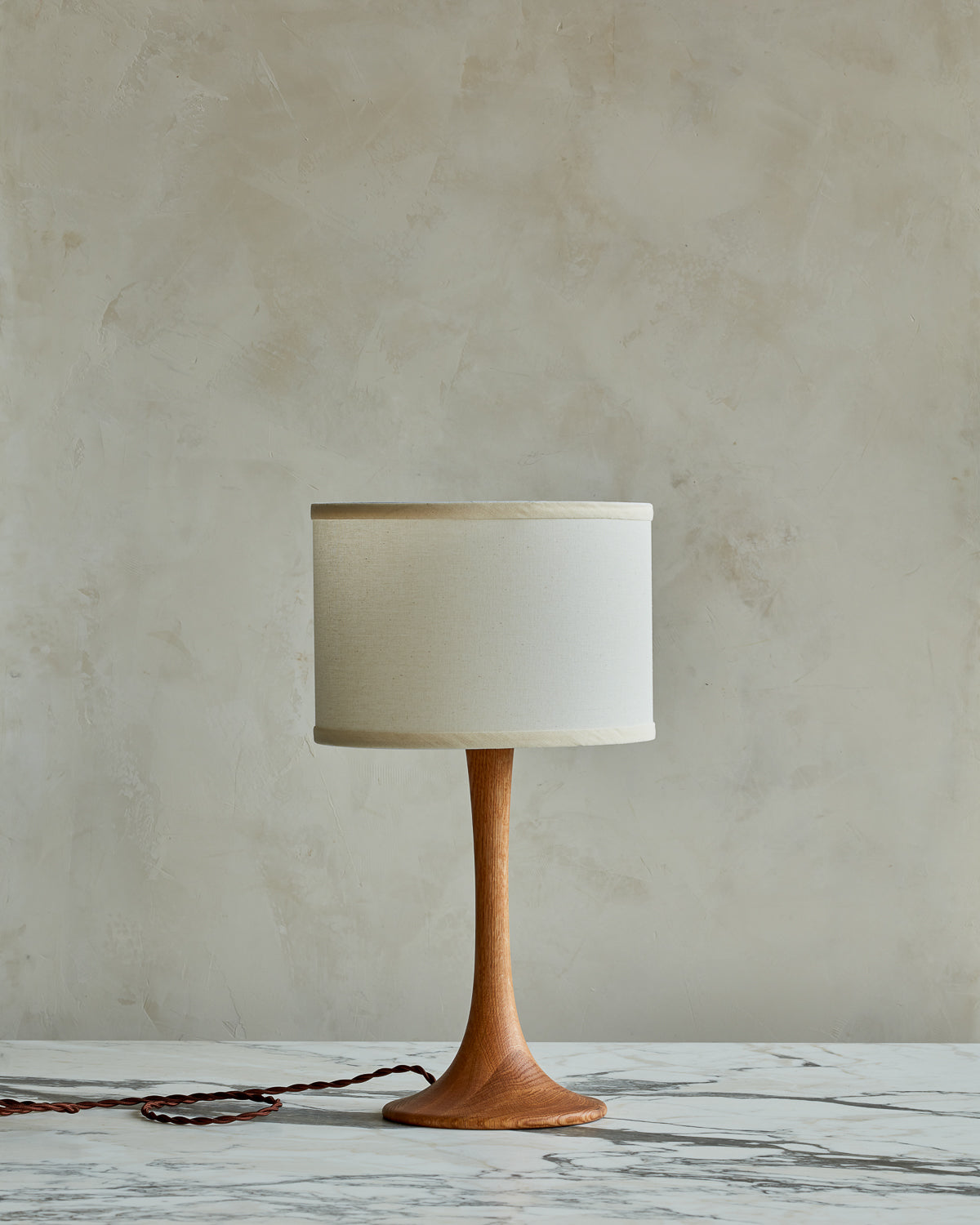 Small Trumpet table lamp with natural finish and ivory drum shade #wood-finish_natural red oak #shade-color_ivory linen