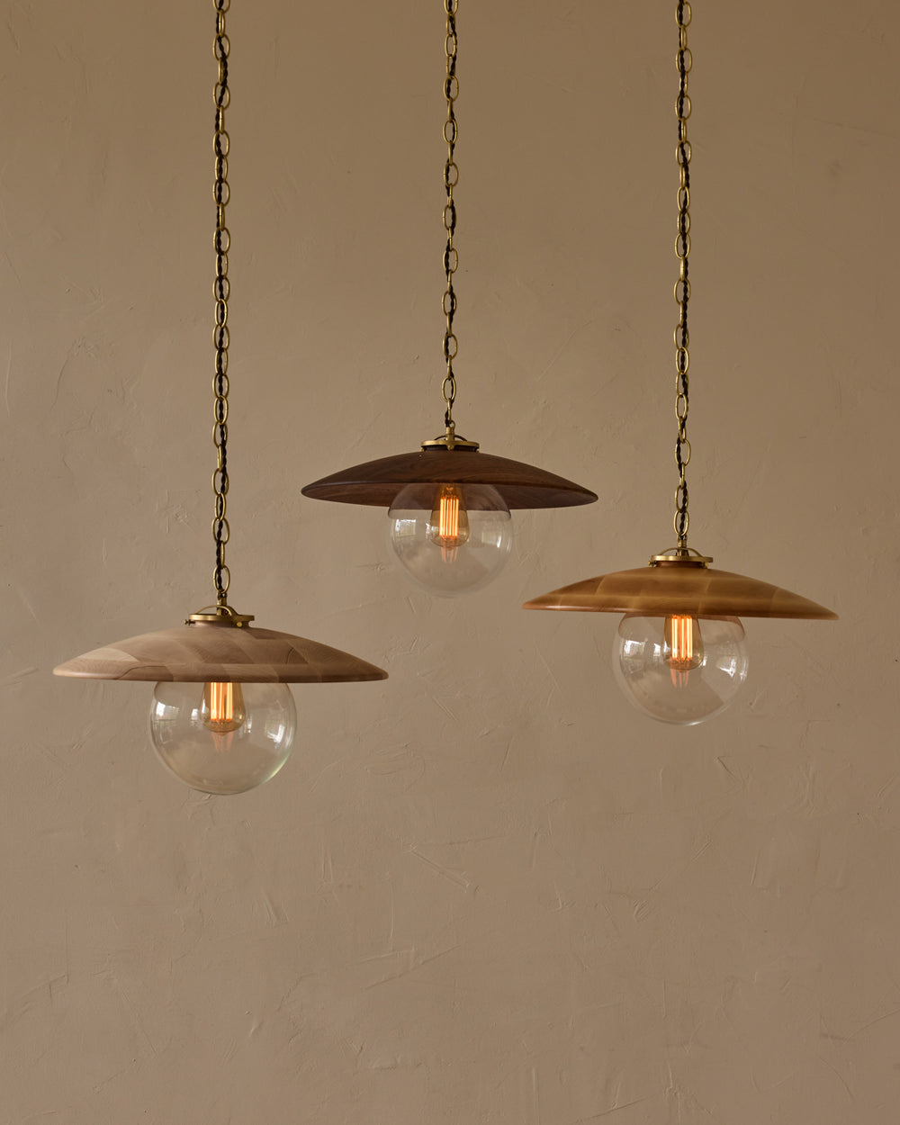 Large pendant light with oversized clear glass globe and decorative wooden clear maple shade with brass chain  #shade-finish_black walnut #globe_clear glass #cord-color_brown
