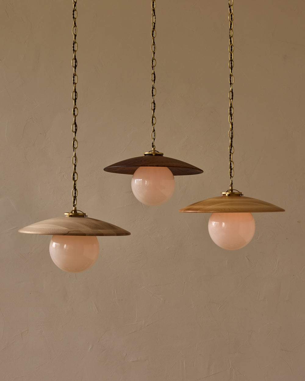 Large pendant light with oversized milk glass globe and decorative wooden clear maple shade with brass chain #shade-finish_clear maple #globe_white glass #cord-color_brown