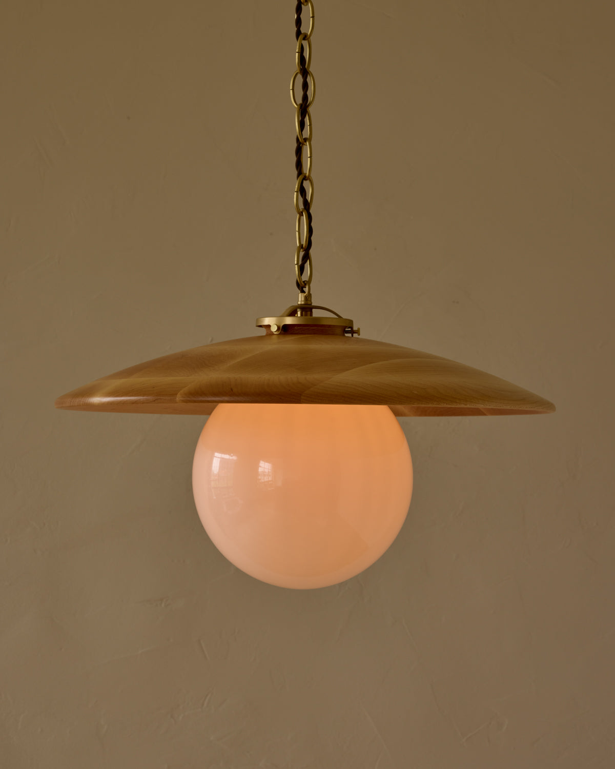 Large pendant light with oversized clear glass globe and decorative wooden clear maple shade with brass chain  #shade-finish_natural maple #globe_white glass #cord-color_brown