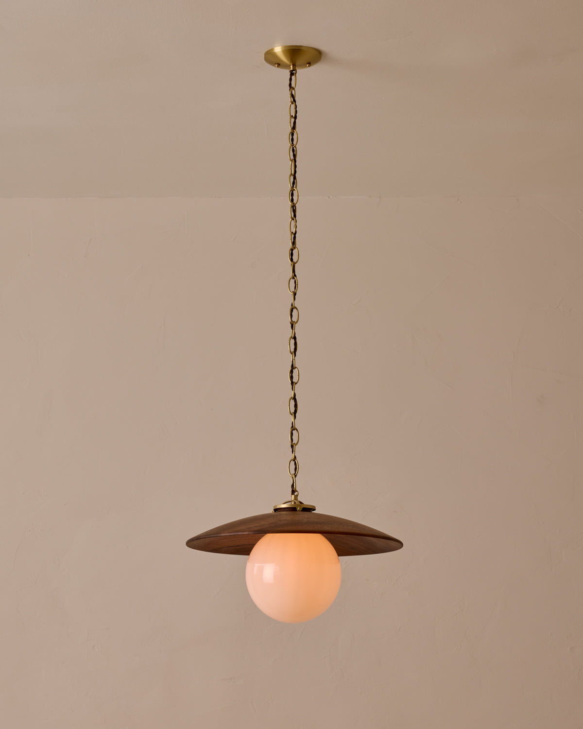 Large pendant light with oversized clear glass globe and decorative wooden clear maple shade with brass chain  #shade-finish_black walnut #globe_white glass #cord-color_brown