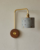 Articulating satin brass sconce with blue handstitched leather shade and walnut backplate #color_cloud blue