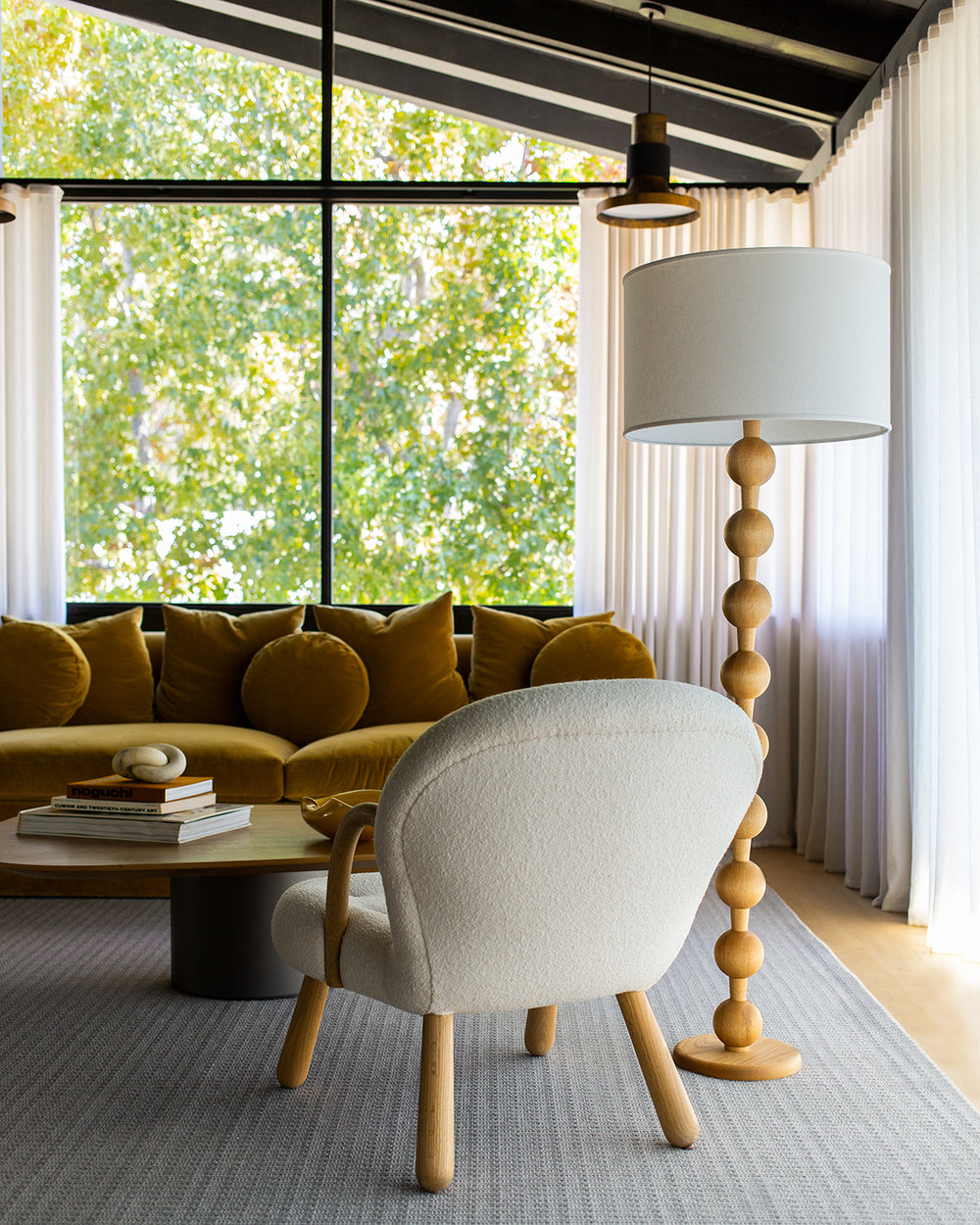 Tall sculptural solid red oak floor lamp with barbell design in natural finish with ivory linen drum shade, best seller, made in the USA 
#color_natural red oak
#shade-color_ivory linen
