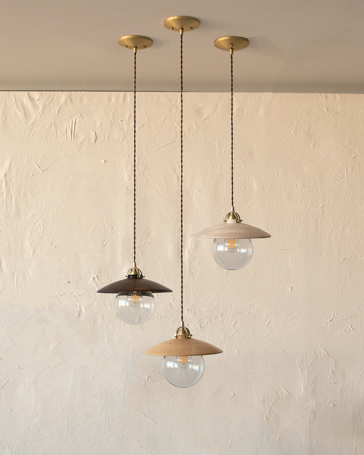 Pendant light with large clear glass globe and decorative wooden natural maple shade