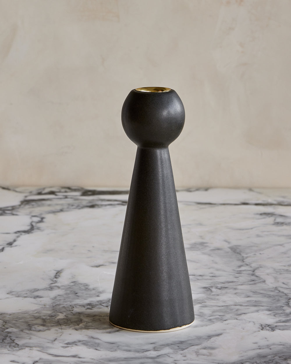 Almost Black Bella ceramic candle holder with gently tapered base in matte black glaze #style_bella