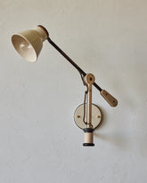 Maple, steel and ceramic wall sconce with articulating arm with glossy white stoneware shade #color_cream