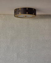 Beautiful satin brass flush mount ceiling fixture with handstitched leather drum shade #leather-color_black harness