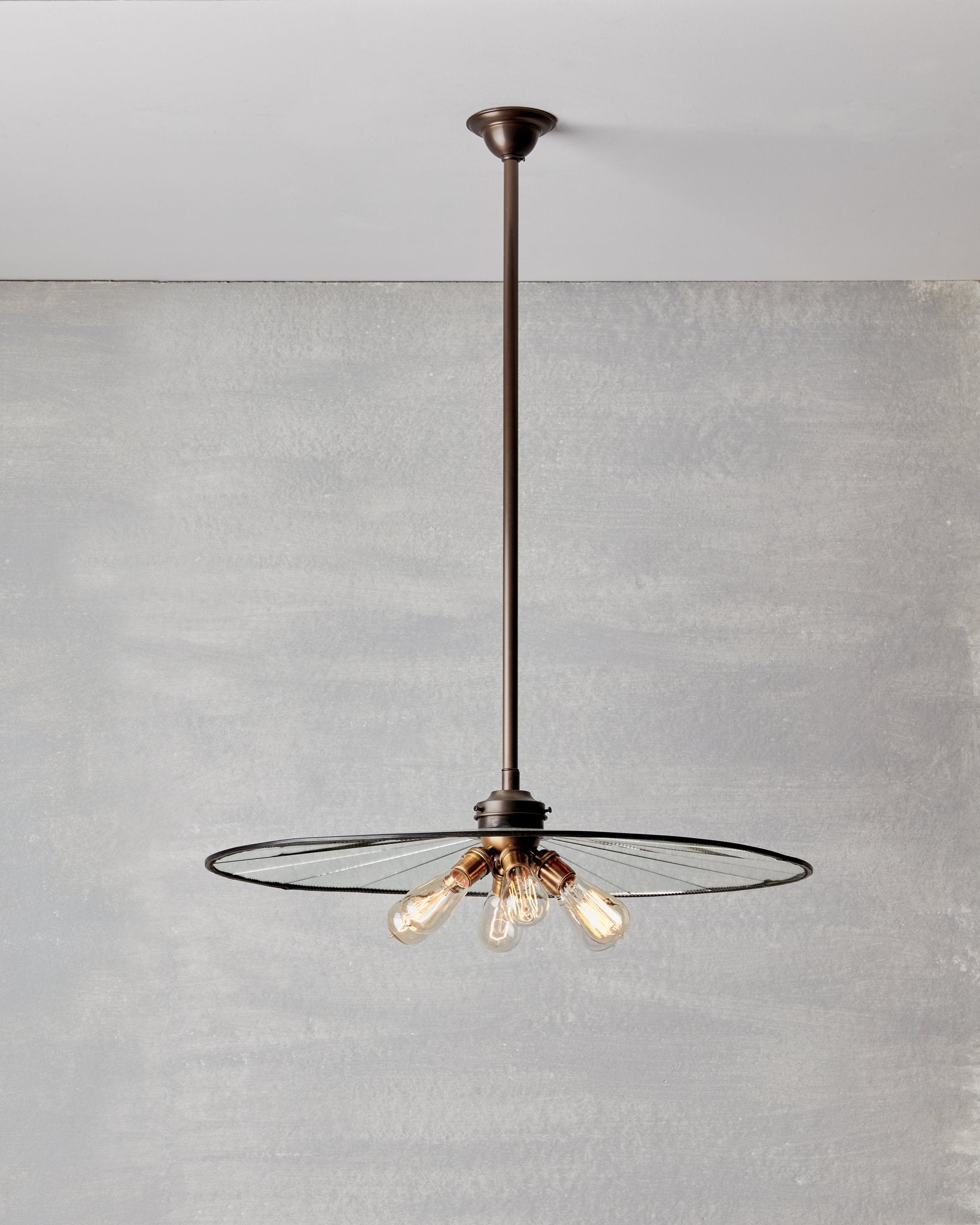 Large flat mirrored ceiling pendant with exposed lightbulbs. Made by RTO Lighting in Philadelphia. Hardwired light fixture. Simple interior design, made in the USA.