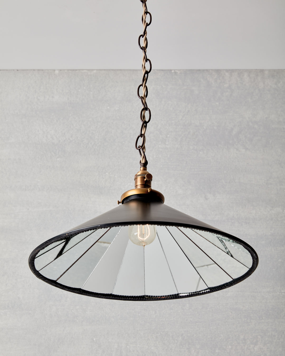 Classic large modern mirrored cone pendant with oil rubbed brass chain.  Hardwired light fixture. Simple interior design, made in the USA. #size_18" cone