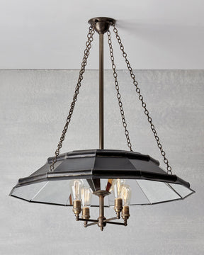 Victorian style metal chandelier with mirrored interior and edison bulbs